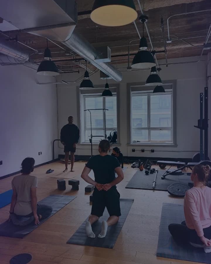 On-site gym with mats and weights at Frontiertower.